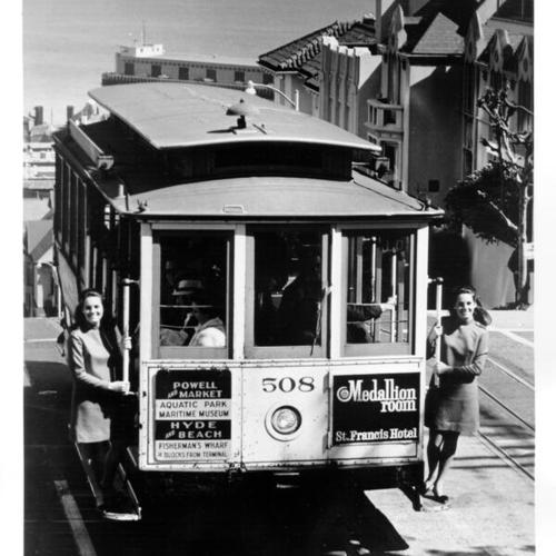 [Kathleen and Maureen Hazelton riding a cable car on Hyde Street]