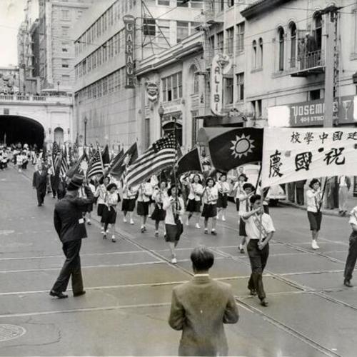 [Chinese and Chinese-Americans parading in honor of the 32nd anniversary of the Chinese Republic, on Stockton Street]