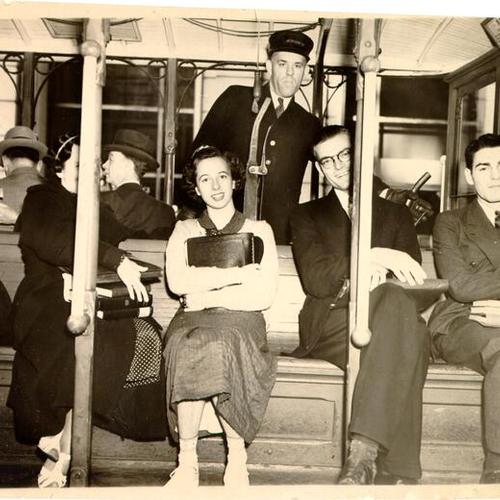 [Cable car operator with his passengers]