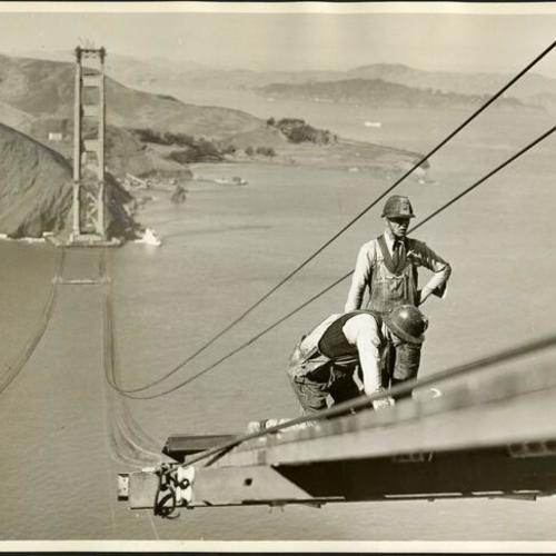[Two construction workers on the Golden Gate Bridge]