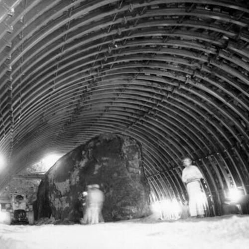[Workmen removing core of earth in Waldo Tunnel]