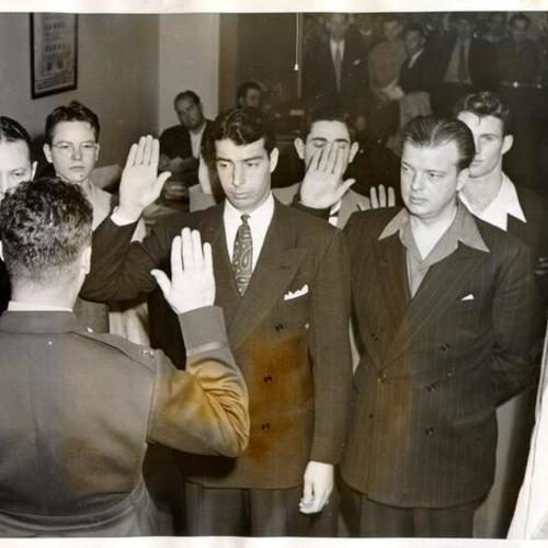 [Joe Di Maggio and a group of inductees being sworn into the U. S. Army]