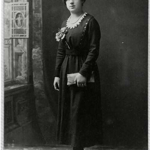 [Esther posing at a photographers studio in 1920]