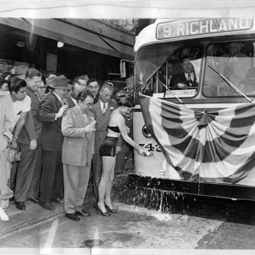[Municipal Railway trackless trolley car number 742 being christened on 20th and Mission Street]