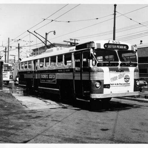 [Municipal railway trackless trolley line 4 car number 595, exiting bus wash]