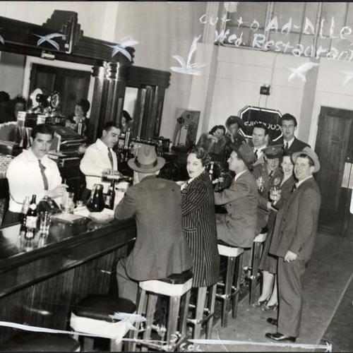 [Owners Sam and Johnny Ormando pouring drinks for their patrons at Ormando's bar]