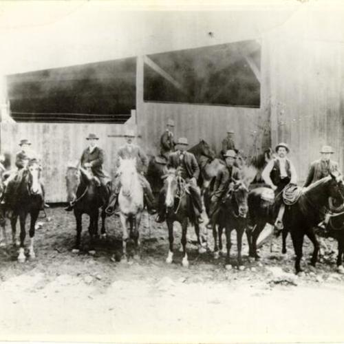 [Group of men on horseback posing for a picture in Visitacion Valley]