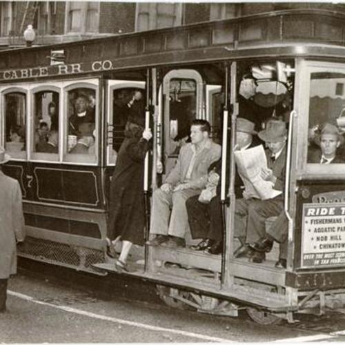 [Passengers boarding a California Street cable car]