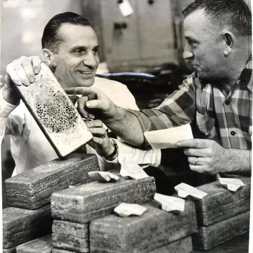 [Jack Carr and Arch Lungredi with gold bars at the U. S. Mint in San Francisco]