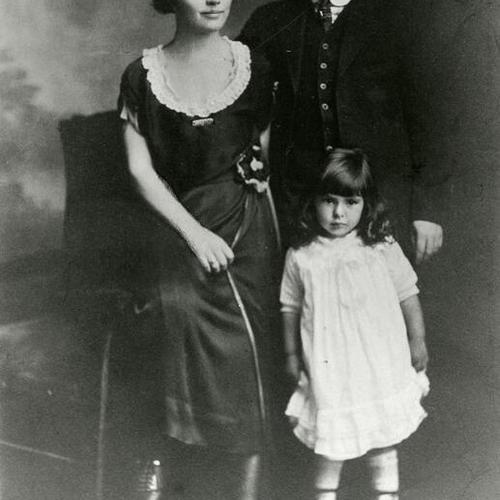 [Studio shot of Val with her parents in San Francisco]