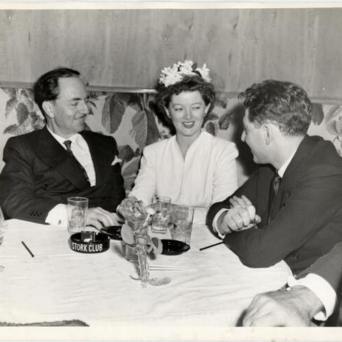 [William Powell, Myrna Loy and her husband John Hertz Jr. at the Stork Club]