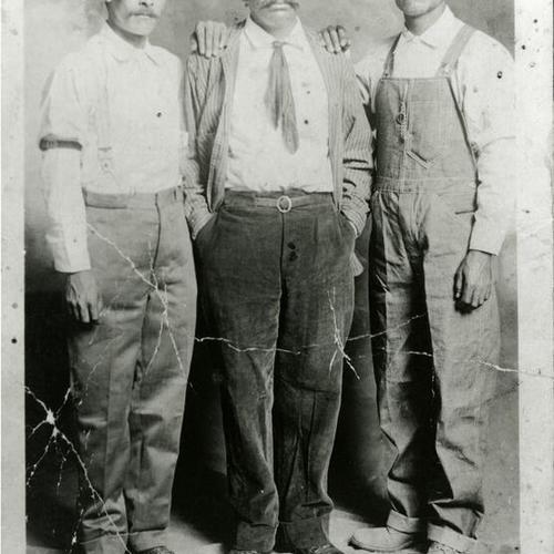[Portrait of three men]