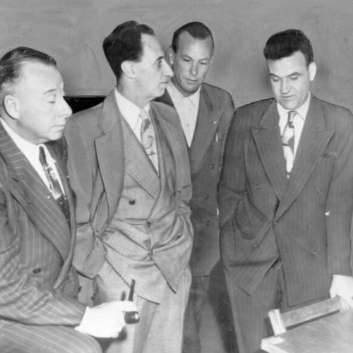 [Harry Bridges with his co-defendants in court during his perjury trial]