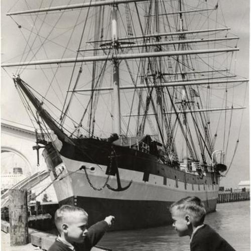 [6-year old twins Steven and Clifford Mein looking at the sailing ship "Balclutha" at Pier 43]