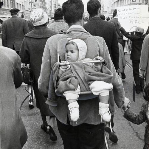 [Baby Debbie Stevenson participating with 12,000 people in the march in protest against racial oppression]