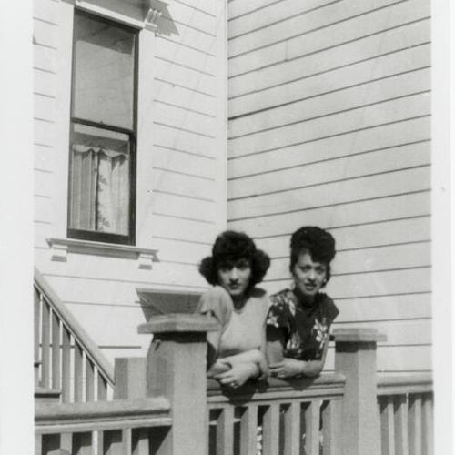 [Portrait of two women in front of home on Elizabeth Street]