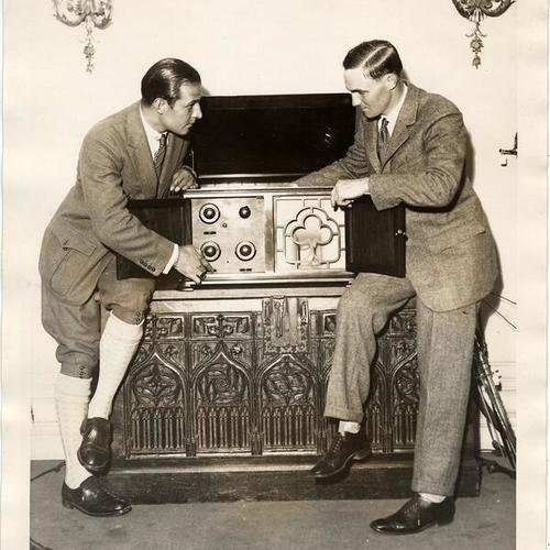 [Rudolph Valentino with Alfred Grebe testing a new radio]