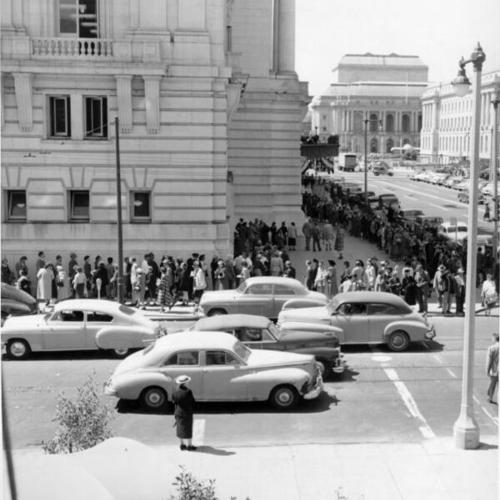 [Crowds of people lining up in front of the Civic Auditorium]