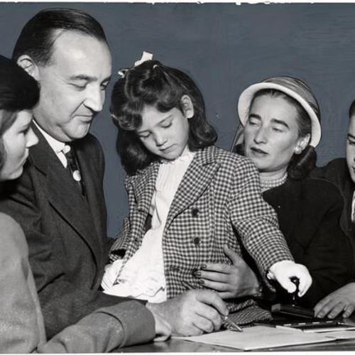 [District Attorney Edmund G. Brown surrounded by his family as he files his declaration of candidancy for the office of state attorney general]