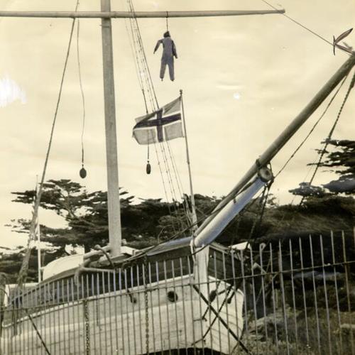 ["Effigy" hanging from yardarm of the Gjoa ship, on display in Golden Gate Park]