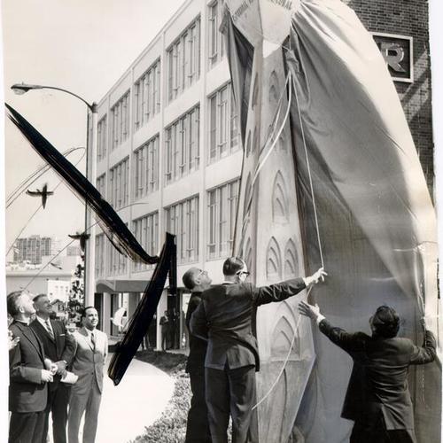 [Dedication of pylon at the intersection of Geary Boulevard and Gough Street identifying the Cathedral Hill area]