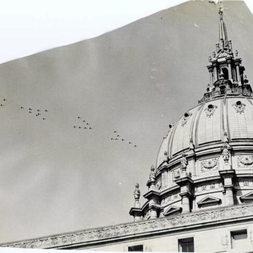 [U. S. Navy planes flying above City Hall]