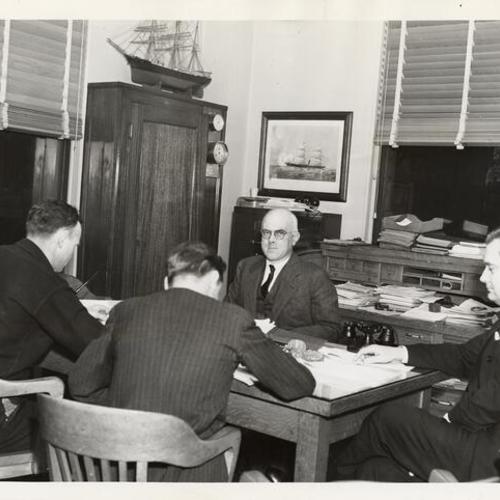 [Representatives of striking seamen and marine firemen discussing terms with representatives of shipowners]