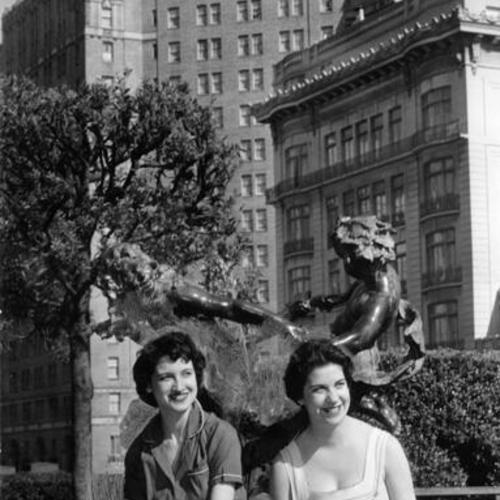 [Marge Peters and Mary McNulty sitting in Huntington Park, with the Mark Hopkins Hotel in the background]