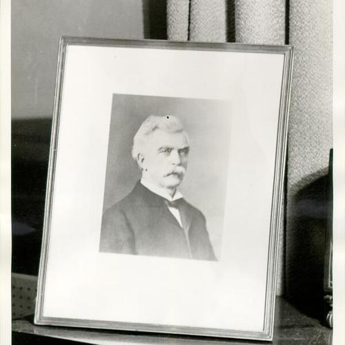 [Photograph of framed portrait of unidentified man]