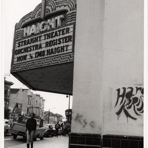 [Woman walking by the Haight Theater at 1748 Haight Street]