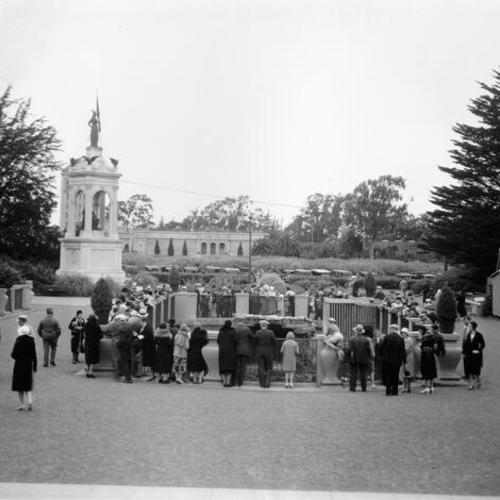 [Visitors outside the Steinhart Aquarium in Golden Gate Park gathered around the seal pool]