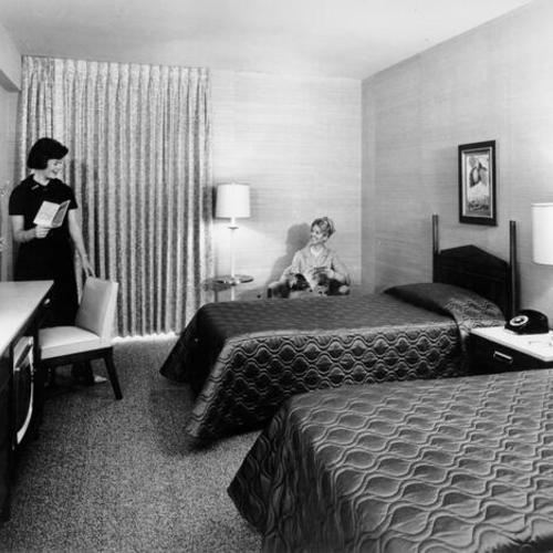 [Guest room with twin beds inside the San Francisco Hilton]