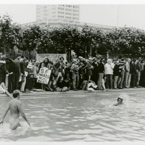 [A crowd of people at the reflecting pool at the Civic Center during Gay Pride Day in 1974]