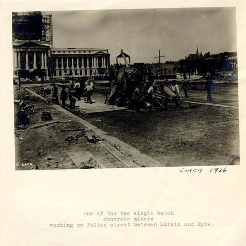 [Workers spreading concrete on Fulton Street, across from City Hall]