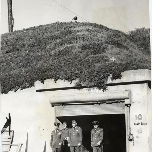 [Group of Air Force officers inspecting a bunker at Fort Miley]