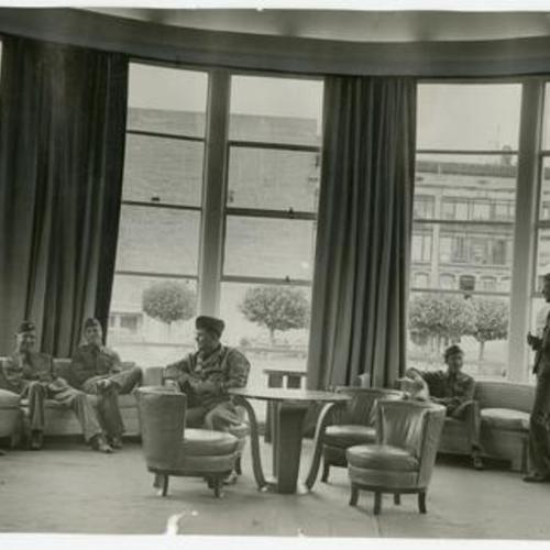 [Service men in main lounge of Hospitality House]