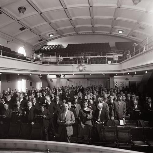 People attending services in Y. M. C. A. auditorium