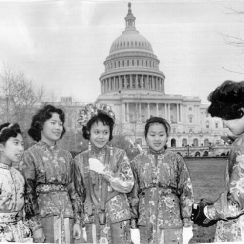 [Members of St. Mary's Chinese Girls Band posing for a picture on the mall behind the Capitol in Washington D.C.]