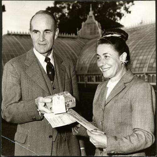 [D. Lyle Ghirardelli presents seeds from Costa Rica to Mrs. Sydney Stein Rich, chief gardener at the Conservatory of Flowers in Golden Gate Park]
