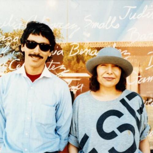 [Mike and Yolanda in front of a window display at La Galeria de la Raza]