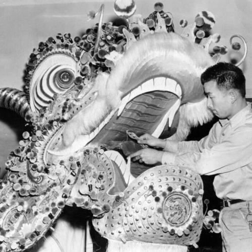 [Travis Yick helping to assemble the dragon to be used in the Chinese New Year's celebration]
