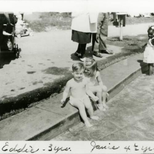 [Jane and her brother Eddie playing in wading pool at San Francisco Zoo]