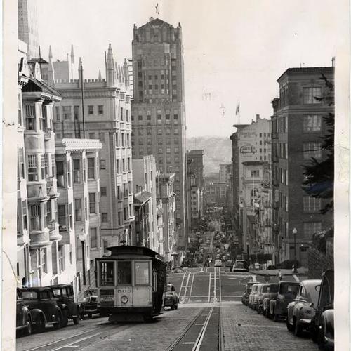 [Cable car ascending Powell Street hill]