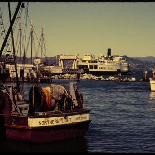 Fishing boats and ferry docked at Fishermen's Wharf