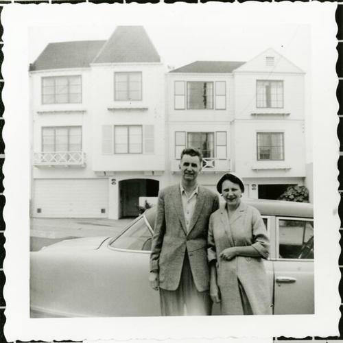 [James and Davis standing in front of their 1952 Nash on 35th Avenue]