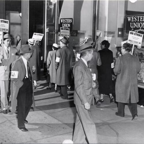 [Striking employees picketing Western Union office on Geary Street]