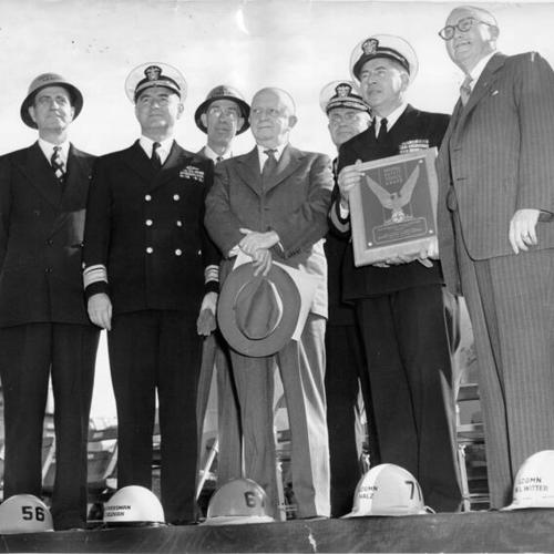 [Group of men accepting an award given to the Hunters Point Naval Shipyard by the National Safety Council]