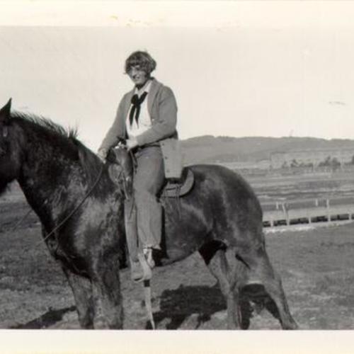 [Unidentified woman riding a horse in Visitacion Valley]