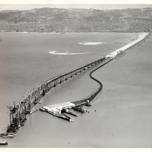 [Aerial view of east end of the San Francisco-Oakland Bay Bridge under construction]