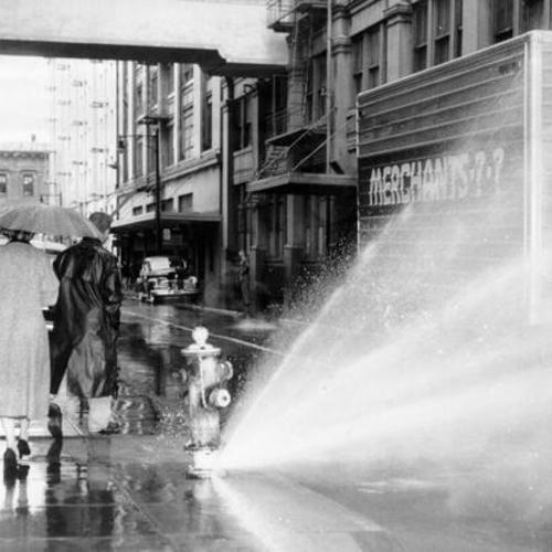 [Jessie street hydrant spewing water after it was hit by a large truck]